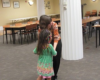 Neighbors | Jessica Harker.Librarian Hayley McEwing danced with Maryan Wibowo during the Back to School Bash event a the Poland library Sept. 17.