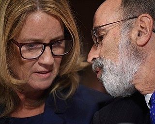Christine Blasey Ford listens to her attorney Michael Bromwich as she testifies to the Senate Judiciary Committee on Capitol Hill in Washington, Thursday, Sept. 27, 2018. (Saul Loeb/Pool Photo via AP)