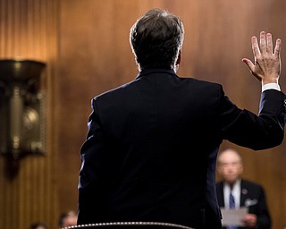 Supreme Court nominee Judge Brett Kavanaugh is sworn in by Chairman Chuck Grassley, R-Iowa, before testifying during the Senate Judiciary Committee, Thursday, Sept. 27, 2018 on Capitol Hill in Washington. (Tom Williams/Pool Image via AP)