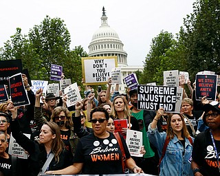 Protesters opposing Supreme Court nominee Brett Kavanaugh march outside the U.S. Capitol on Capitol Hill in Washington, Thursday, Sept. 27, 2018. (AP Photo/Patrick Semansky)