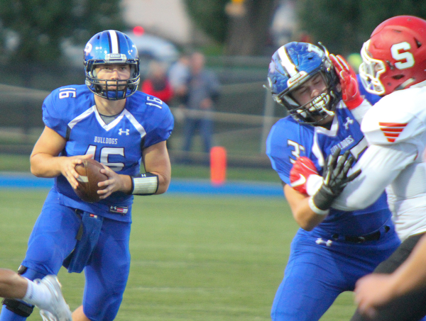William D. Lewis The Vindicator Poland QB Cole Kosco(16) during 9-28-18 game with Struthers.