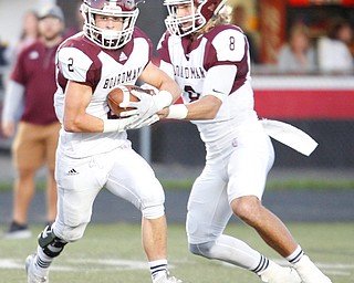 Boardman's Mike O'Horo (8) passes the ball off to Joe Ieraci during the first half of their game against Canfield at Canfield on Friday. EMILY MATTHEWS | THE VINDICATOR