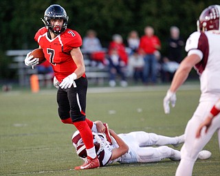 Canfield's Matt Zaremski tries to get away from Boardman's Tyler Peterson during the first half of their game at Canfield on Friday. EMILY MATTHEWS | THE VINDICATOR