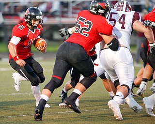 Canfield's Max Dawson runs with the ball during the first half of their game against Boardman at Canfield on Friday. EMILY MATTHEWS | THE VINDICATOR