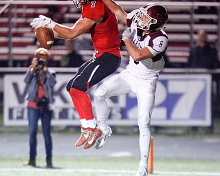 Canfield's Matt Zaremski intercepts the ball to prevent Boardman's Josh Rodriguez from scoring during the first half of their game at Canfield on Friday. EMILY MATTHEWS | THE VINDICATOR