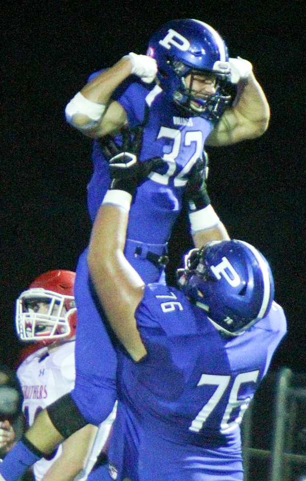 William D. Lewis The Vindicator Poland's Jake Rutana(32) gets congrats from Alex Feliiano(76) after scoring during 2nd qtr of 9-28-18 action at Poland.