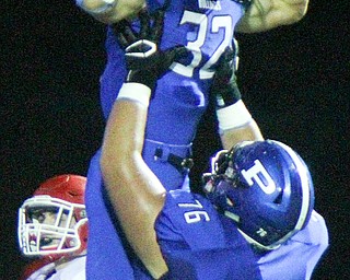 William D. Lewis The Vindicator Poland's Jake Rutana(32) gets congrats from Alex Feliiano(76) after scoring during 2nd qtr of 9-28-18 action at Poland.