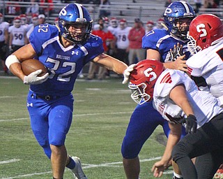 William D. Lewis The Vindicator Poland's Jake Rutana(32) eludes Struthers' Zach Ziccardi(44) during 9-28-18 action at Poland.