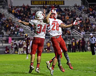 LIBERTY, OHIO - SEPTEMBER 28, 2018: LaBrae's Nathaniel Ostas, right, and Colton Stoneman celebrate after a touchdown by Stoneman during the first half of their game, Friday night at Liberty High School. DAVID DERMER | THE VINDICATOR