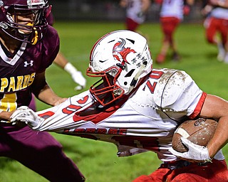 LIBERTY, OHIO - SEPTEMBER 28, 2018: LaBrae's Benton Tennant, right, is grabbed by Liberty's Savion Watson during the first half of their game, Friday night at Liberty High School. DAVID DERMER | THE VINDICATOR