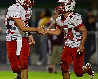 LIBERTY, OHIO - SEPTEMBER 28, 2018: LaBrae's Kent Wolford, left, congratulates Colton Stoneman after he scored a touchdown during the first half of their game, Friday night at Liberty High School. DAVID DERMER | THE VINDICATOR