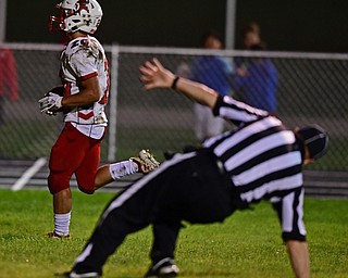 LIBERTY, OHIO - SEPTEMBER 28, 2018: LaBrae's Benton Tennant scores a touchdown on a halfback pass as the referee slips in the end zone during the first half of their game, Friday night at Liberty High School. DAVID DERMER | THE VINDICATOR