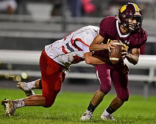 LIBERTY, OHIO - SEPTEMBER 28, 2018: Liberty's Hamad Alhmeed is wrapped up by LaBrae's Justin Rutherford during the first half of their game, Friday night at Liberty High School. Alhmeed would throw a interception on the play.  DAVID DERMER | THE VINDICATOR