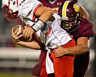 LIBERTY, OHIO - SEPTEMBER 28, 2018: LaBrae's Kent Wolford is brought down by Liberty's Simi Moananu during the first half of their game, Friday night at Liberty High School. DAVID DERMER | THE VINDICATOR