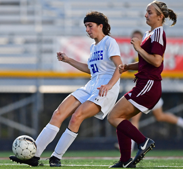 NORTH LIMA, OHIO - OCTOBER 1, 2018: Poland's Jackie Grisdale shoots and scores after beating South Range's Marlaina Slabach to the ball during the first half of their game, Monday night at South Range High School. DAVID DERMER | THE VINDICATOR
