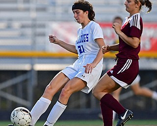 NORTH LIMA, OHIO - OCTOBER 1, 2018: Poland's Jackie Grisdale shoots and scores after beating South Range's Marlaina Slabach to the ball during the first half of their game, Monday night at South Range High School. DAVID DERMER | THE VINDICATOR