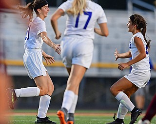 NORTH LIMA, OHIO - OCTOBER 1, 2018: Poland's Jackie Grisdale, left, is congratulated by Mia Marantis after scoring a goal during the first half of their game, Monday night at South Range High School. DAVID DERMER | THE VINDICATOR