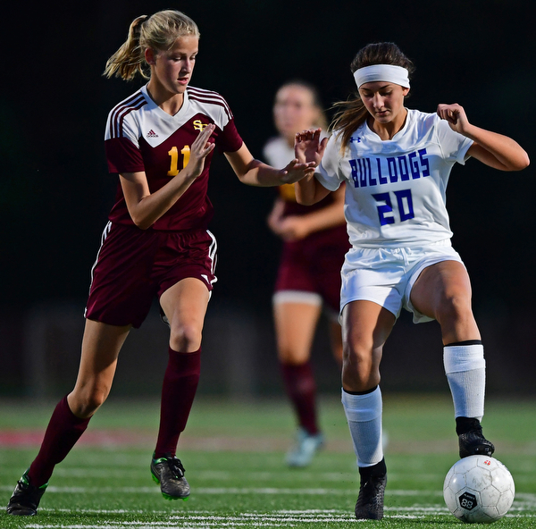 NORTH LIMA, OHIO - OCTOBER 1, 2018: Poland's Syda Masucci dribbles the ball while being pressured by South Range's Harley Novak during the first half of their game, Monday night at South Range High School. DAVID DERMER | THE VINDICATOR