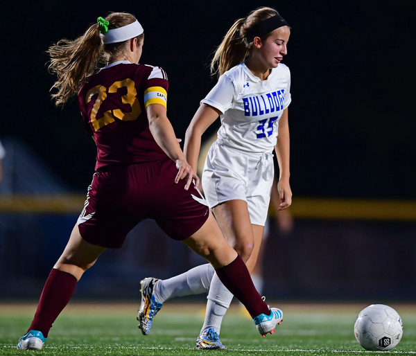 NORTH LIMA, OHIO - OCTOBER 1, 2018: Poland's Molly Malmer moves the ball ahead of South Range's Natalie Plunkett during the first half of their game, Monday night at South Range High School. DAVID DERMER | THE VINDICATOR