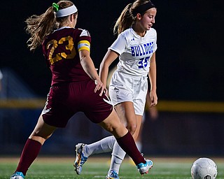 NORTH LIMA, OHIO - OCTOBER 1, 2018: Poland's Molly Malmer moves the ball ahead of South Range's Natalie Plunkett during the first half of their game, Monday night at South Range High School. DAVID DERMER | THE VINDICATOR