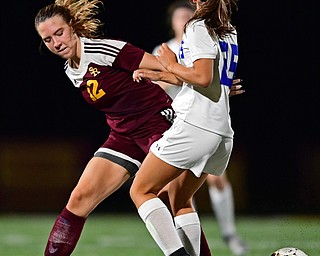 NORTH LIMA, OHIO - OCTOBER 1, 2018: South Range's Rachel Maynard attempts to play the ball while being pressured by Poland's Mia Marantis during the second half of their game, Monday night at South Range High School. DAVID DERMER | THE VINDICATOR