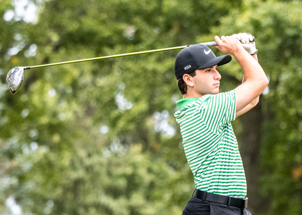 DIANNA OATRIDGE | THE VINDICATOR  Ursuline's Nicco Sabella watches his tee shot on Hole No. 10 during play at the Division II District Tournament at Windmill Lakes Golf Course in Ravenna on Tuesday.