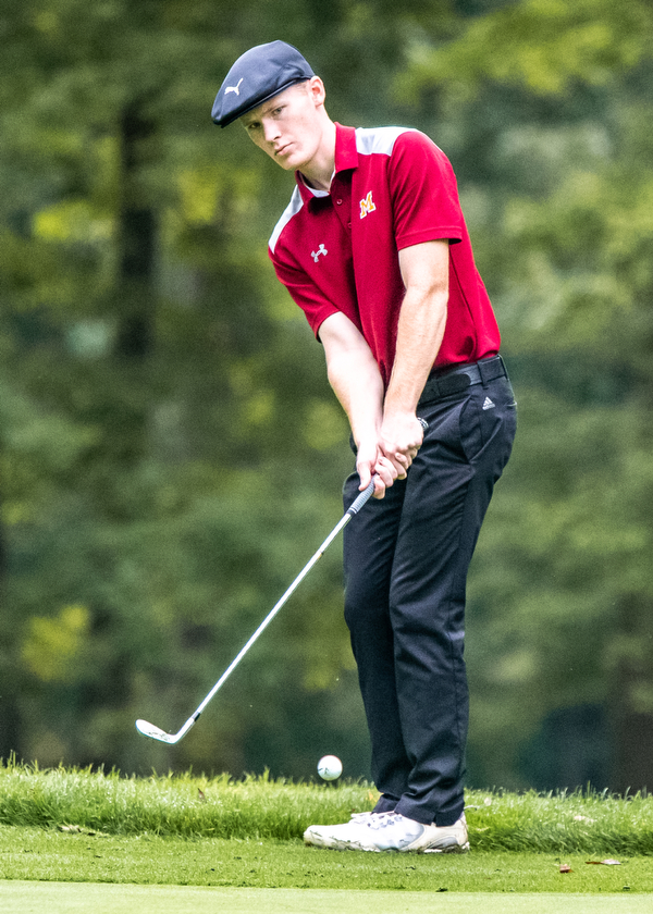 DIANNA OATRIDGE | THE VINDICATOR  Cardinal Mooney's Keegan Butler chips on to the Par 4, No. 7 green while playing in the Division II District Tournament at Windmill Lakes Golf Course in Ravenna on Tuesday.