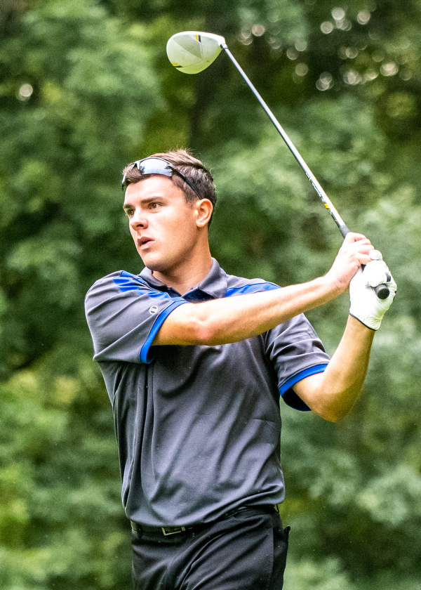 DIANNA OATRIDGE | THE VINDICATOR  Poland's Luke Nord watches his tee shot on Hole No. 5 during Division II District Tournament play at Windmill Lakes Golf Course in Ravenna on Tuesday.