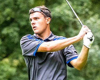 DIANNA OATRIDGE | THE VINDICATOR  Poland's Luke Nord watches his tee shot on Hole No. 5 during Division II District Tournament play at Windmill Lakes Golf Course in Ravenna on Tuesday.