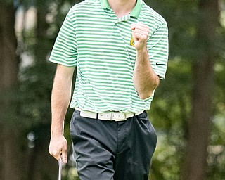 DIANNA OATRIDGE | THE VINDICATOR  Ursuline's Seamus Chrystal reacts with a fist pump after sinking a birdie putt on Hole No. 17 at the Division II District Tournament at Windmill Lakes Golf Course in Ravenna on Tuesday.