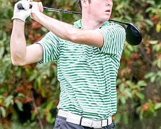 DIANNA OATRIDGE | THE VINDICATOR  Ursuline's Seamus Chrystal watches his tee shot on Hole No. 18 while playing at the Division II District Tournament at Windmill Lakes Golf Course in Ravenna on Tuesday.