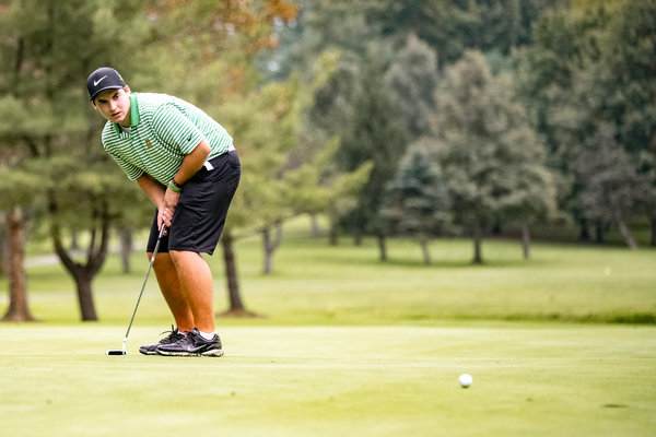 DIANNA OATRIDGE | THE VINDICATOR  Ursuline's Alex Stoneman saves par with his putt on the 18th hole at the Division II District Tournament at Windmill Lakes Golf Course in Ravenna on Tuesday.