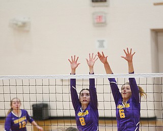 Champion's Maggie Dunlap (8) and Morgan Tenney (6) try to block the ball coming from Liberty's Allyson Jones during their game at Liberty on Wednesday. EMILY MATTHEWS | THE VINDICATOR