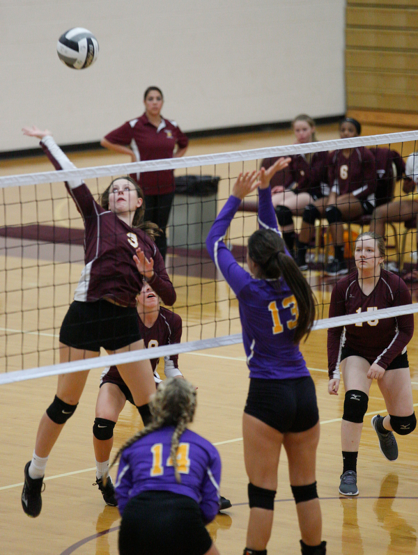 Liberty's Allyson Jones (3) hits the ball over the net to Champion during their game at Liberty on Wednesday. EMILY MATTHEWS | THE VINDICATOR