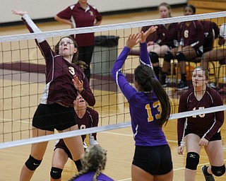 Liberty's Allyson Jones (3) hits the ball over the net to Champion during their game at Liberty on Wednesday. EMILY MATTHEWS | THE VINDICATOR