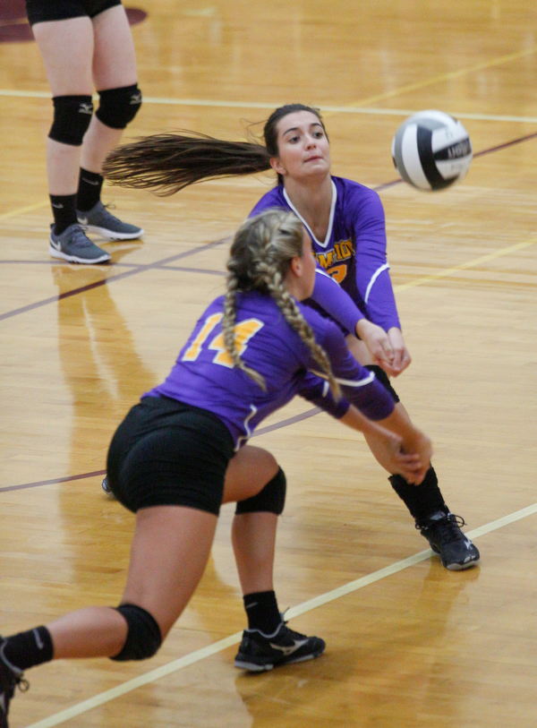 Champion's Jacqueline Seman (13) and Jenna Deer (14) go after the ball during their game against Liberty at Liberty on Wednesday. EMILY MATTHEWS | THE VINDICATOR