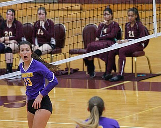 Champion's Jacqueline Seman (13) screams to her teammate Morgan Tenney as the ball heads toward Tenney during their game against Liberty at Liberty on Wednesday. EMILY MATTHEWS | THE VINDICATOR