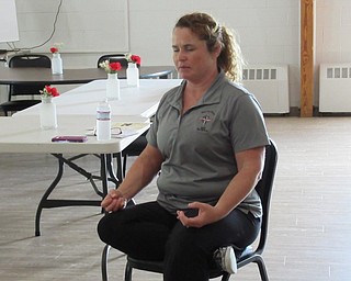 Neighbors | Jessica Harker .Yoga instructor and Family First Adult Care Center employee Shannon Lehn led a class in chair yoga for caregivers.