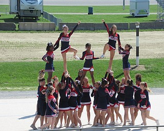 Neighbors | Jessica Harker .Cheerleaders from Austintown High School performed stunts for their cheer demonstration.