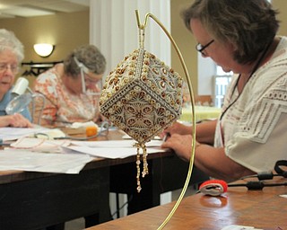 Neighbors | Jessica Harker.An example of the finished piece of counted canvas work that was taught to participants un Sept. 14 through 15 at the Poland library.