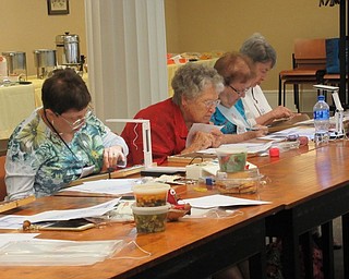 Neighbors | Jessica Harker.Participants attended the counted canvas workshop held for two days at the Poland library Sept. 14, working on a piece of counted canvas presented by the Embroiderers' Guild of Youngstown.