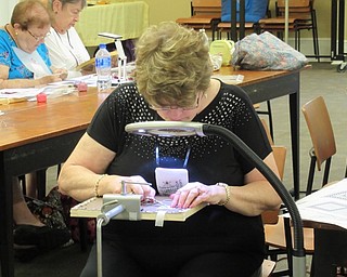 Neighbors | Jessica Harker.A member of the Younsgtown chapter of the Embroiderers' Guild worked on her piece of counted canvas during the two day work shop Sept. 14.