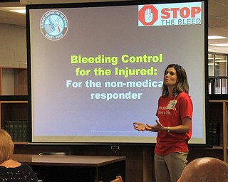 Neighbors | Jessica Harker.Amanda Lencyk from Mercy Health taught a group of educators from Boardman High School how to use tourniquets and pack wounds at the Stop the Bleed training on Sept. 19.