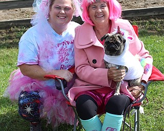 Neighbors | Abby Slanker.Sallie Sullivan (right) a breast cancer survivor, and her daughter, Megan Hruska, were joined by Sullivan’s dog Penny while decked out in their best unicorn gear in support of the fifth annual Survivor Run Hruska organized to honor her mother and other breast cancer survivors and to help spread awareness of early breast cancer detection on Sept. 29.
