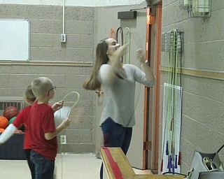 Neighbors | Jessica Harker.Hannah Balash, a senior at Poland high school, helped second-graders put away gym equiptment on Sept. 26 for the Big Dog Little Dog mentorship program.