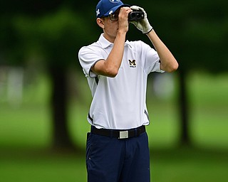 ALLIANCE, OHIO - OCTOBER 4, 2018: Zavier Bokan of McDonald uses a range finder on the 17th hole during the Division 3 district tournament at Tannenhauf Golf Club, Thursday afternoon. DAVID DERMER | THE VINDICATOR