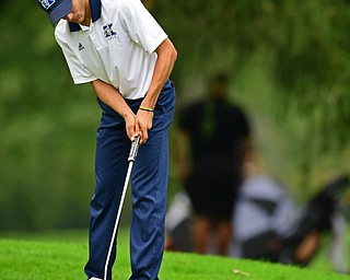 ALLIANCE, OHIO - OCTOBER 4, 2018: Jimmy Graham of JFK watches his putt on the seventh hole during the Division 3 district tournament at Tannenhauf Golf Club, Thursday afternoon. DAVID DERMER | THE VINDICATOR