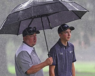 ALLIANCE, OHIO - OCTOBER 4, 2018: Anthony Clark of Brookfield, right, and coach Larry Smoot examine the fairway on the 16th hole during the Division 3 district tournament at Tannenhauf Golf Club, Thursday afternoon. DAVID DERMER | THE VINDICATOR