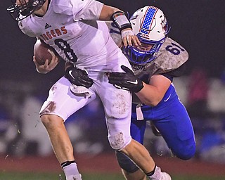 BERLIN CENTER, OHIO - OCTOBER 5, 2018: Springfield's Brannon Brungard, left, is tackled bY Western Reserve's Gavin Jackson during the second half of their game, Friday night at Western Reserve High School. DAVID DERMER | THE VINDICATOR