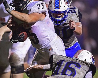 BERLIN CENTER, OHIO - OCTOBER 5, 2018: Springfield's Luke Snyder runs into the end zone to score a touchdown through the tackles of Western Reserve's Jimy Mayberry, bottom, and Brandon Jarvis during the second half of their game, Friday night at Western Reserve High School. DAVID DERMER | THE VINDICATOR